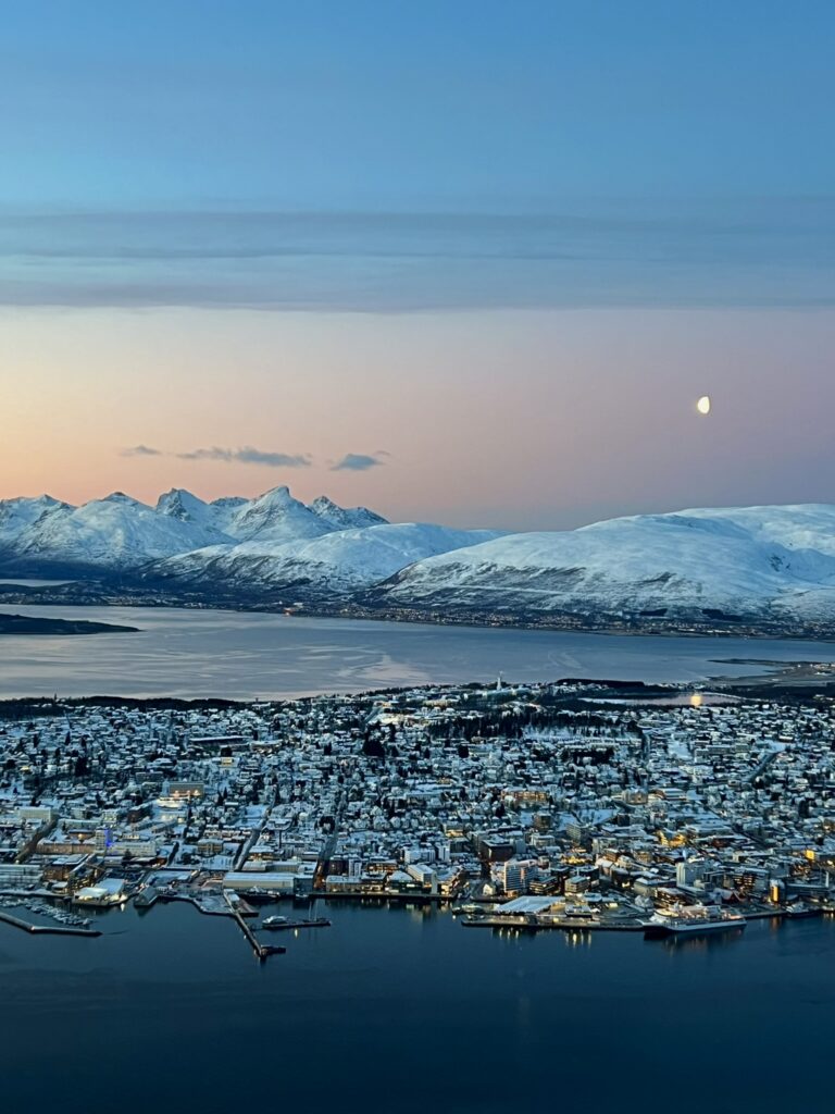 Snowy sunset view of Tromso, Norway from the cable car